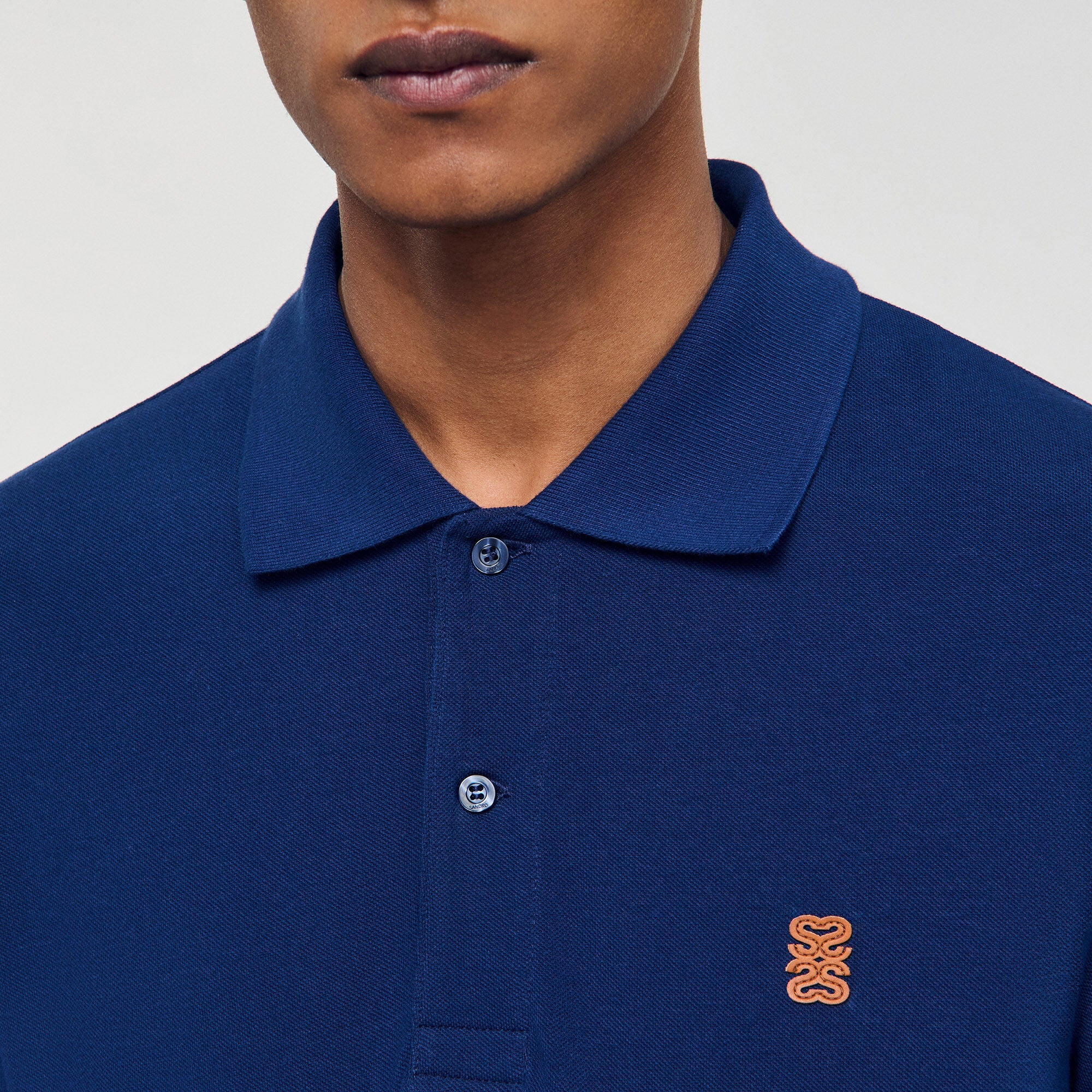 Sandro Men Polo shirt with leather logo